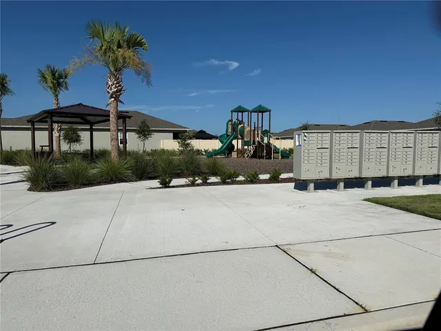 a view of a street with a building in the background