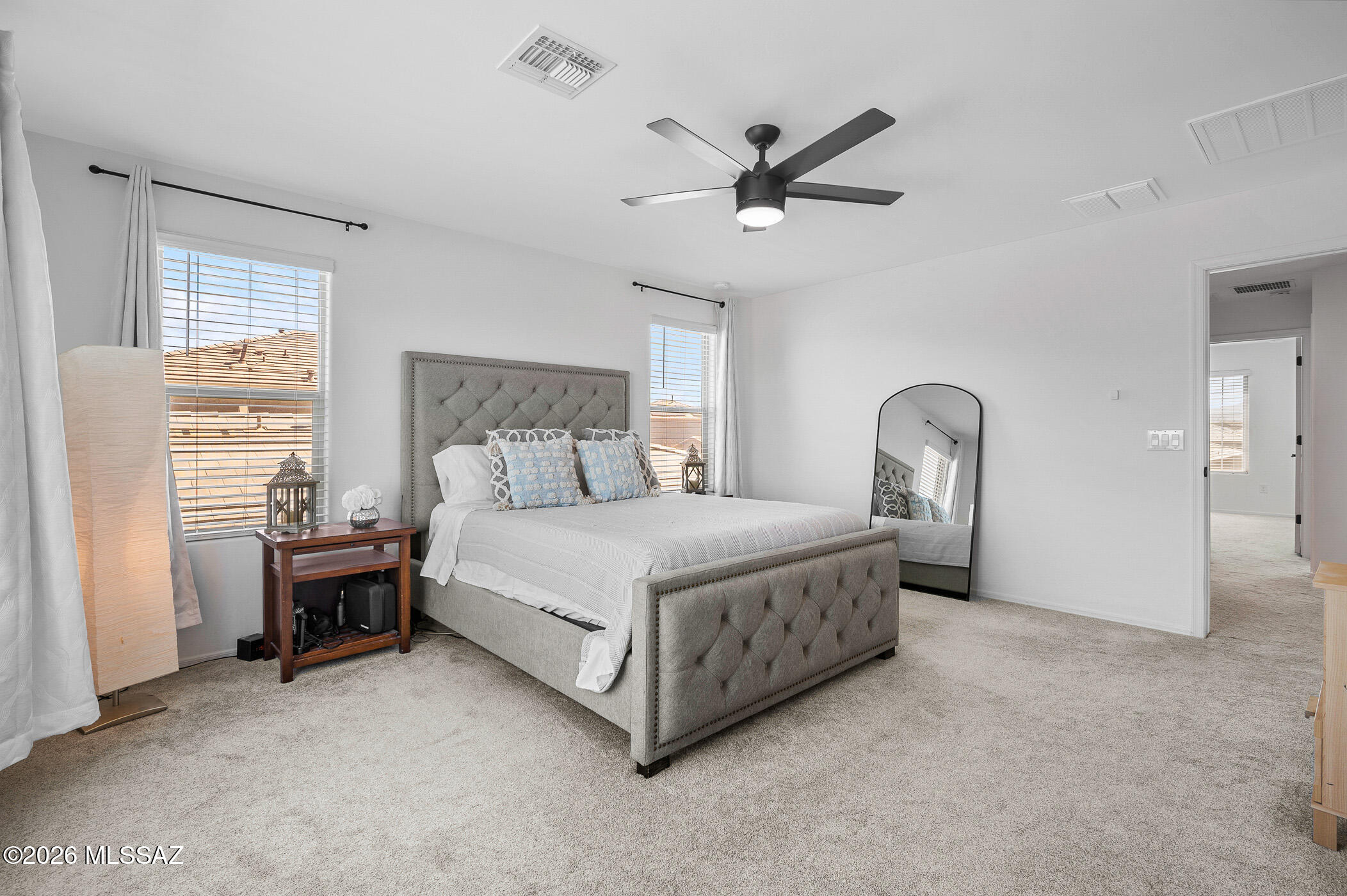 12092 East Ryscott Circle Vail, AZ 85641 - Photo 30 of 49 a bedroom with a bed and a chandelier