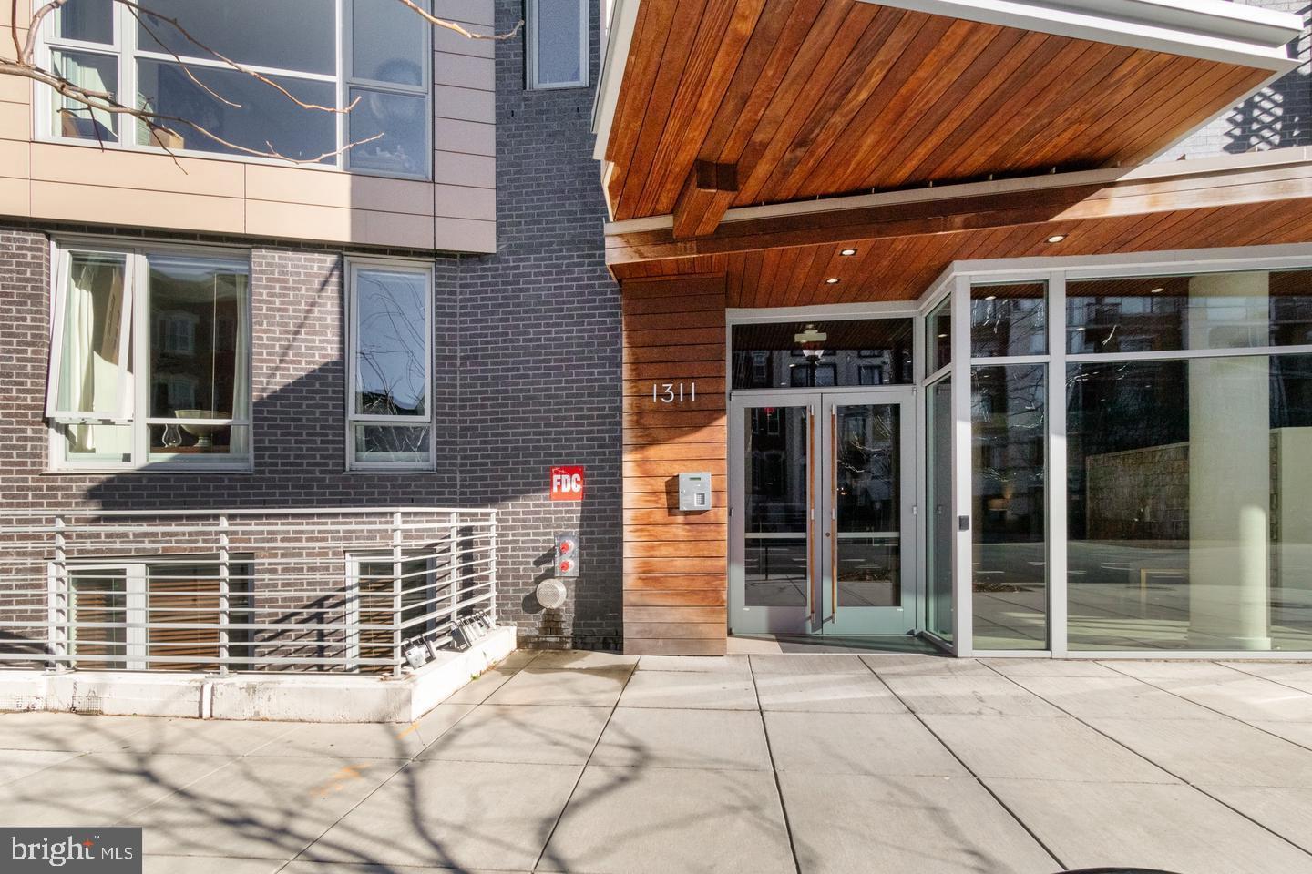 1311 13th Street Northwest, Unit T05 Washington, DC 20005 - Photo 13 of 17 front view of a brick house with a window