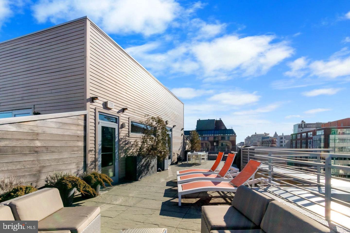 1311 13th Street Northwest, Unit T05 Washington, DC 20005 - Photo 15 of 17 a sitting area with furniture on the deck
