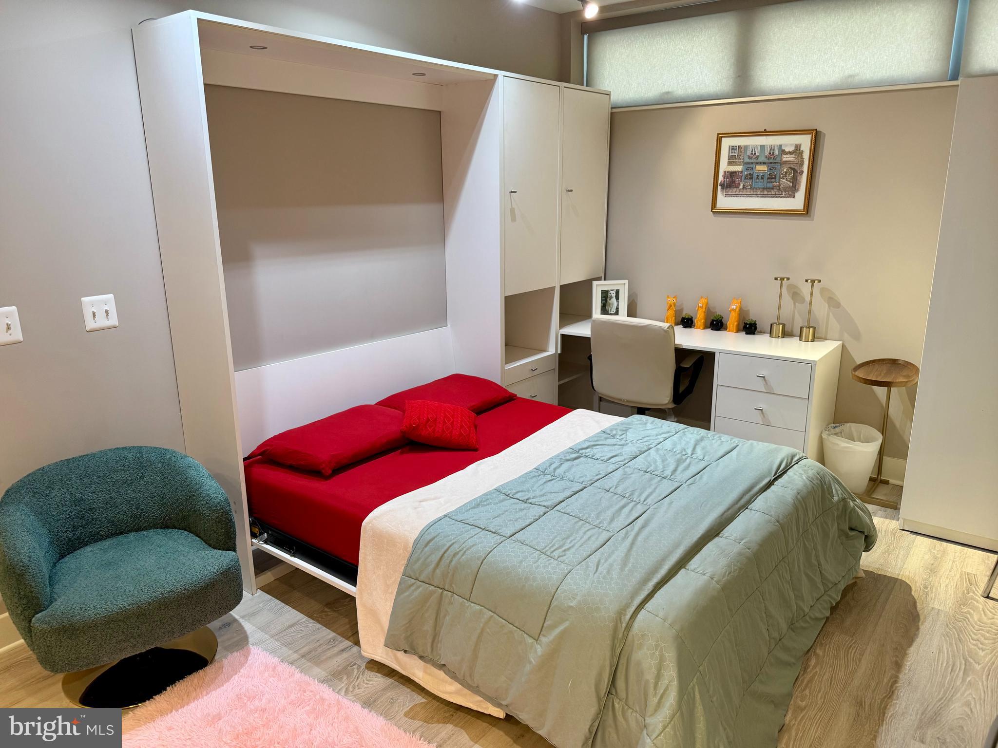 1311 13th Street Northwest, Unit T05 Washington, DC 20005 - Photo 6 of 17 a bedroom with a bed and a mirror