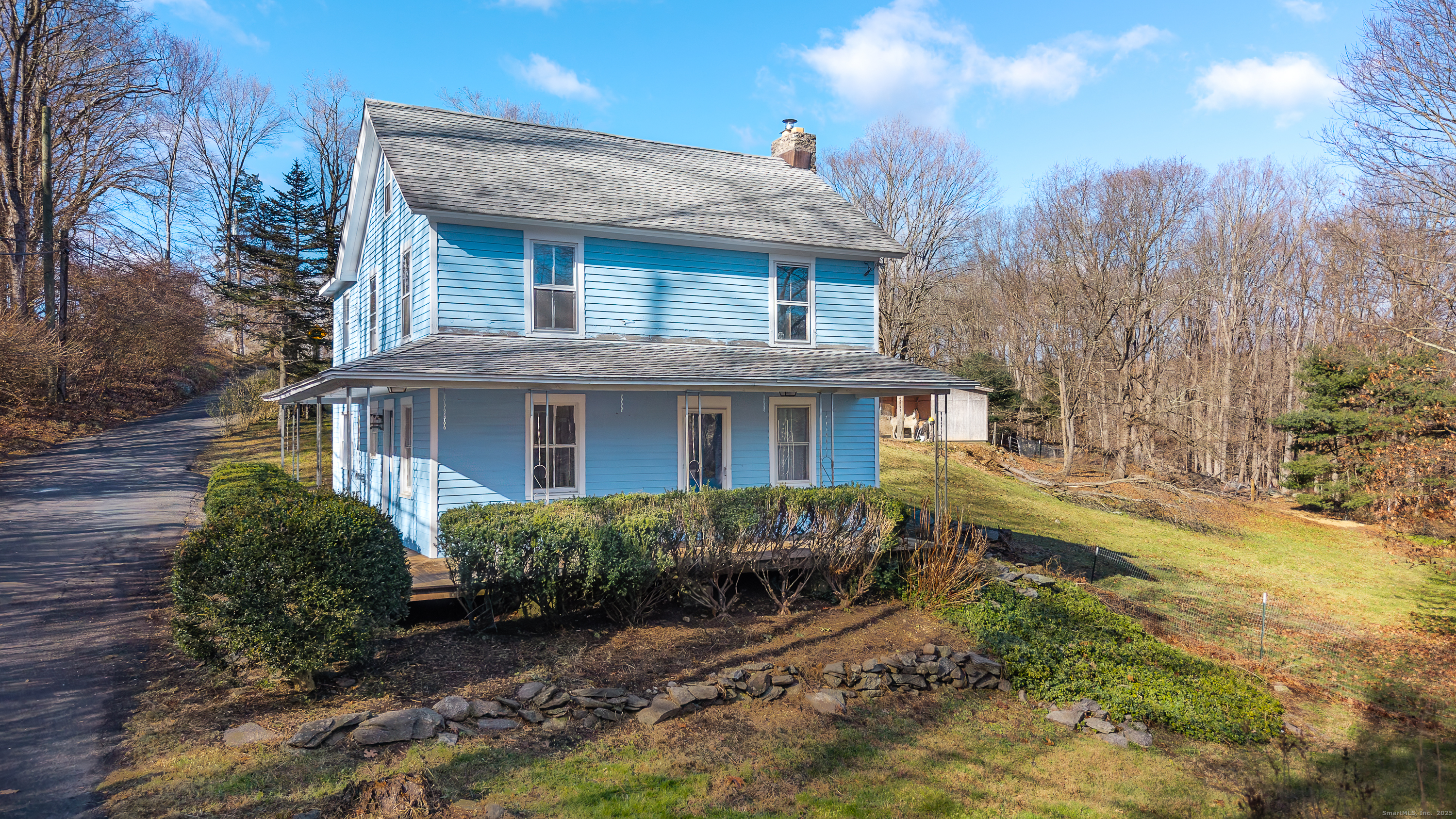 2 Stony Brook Road Newtown, CT 06470 - Photo 20 of 29 a front view of a house with a yard