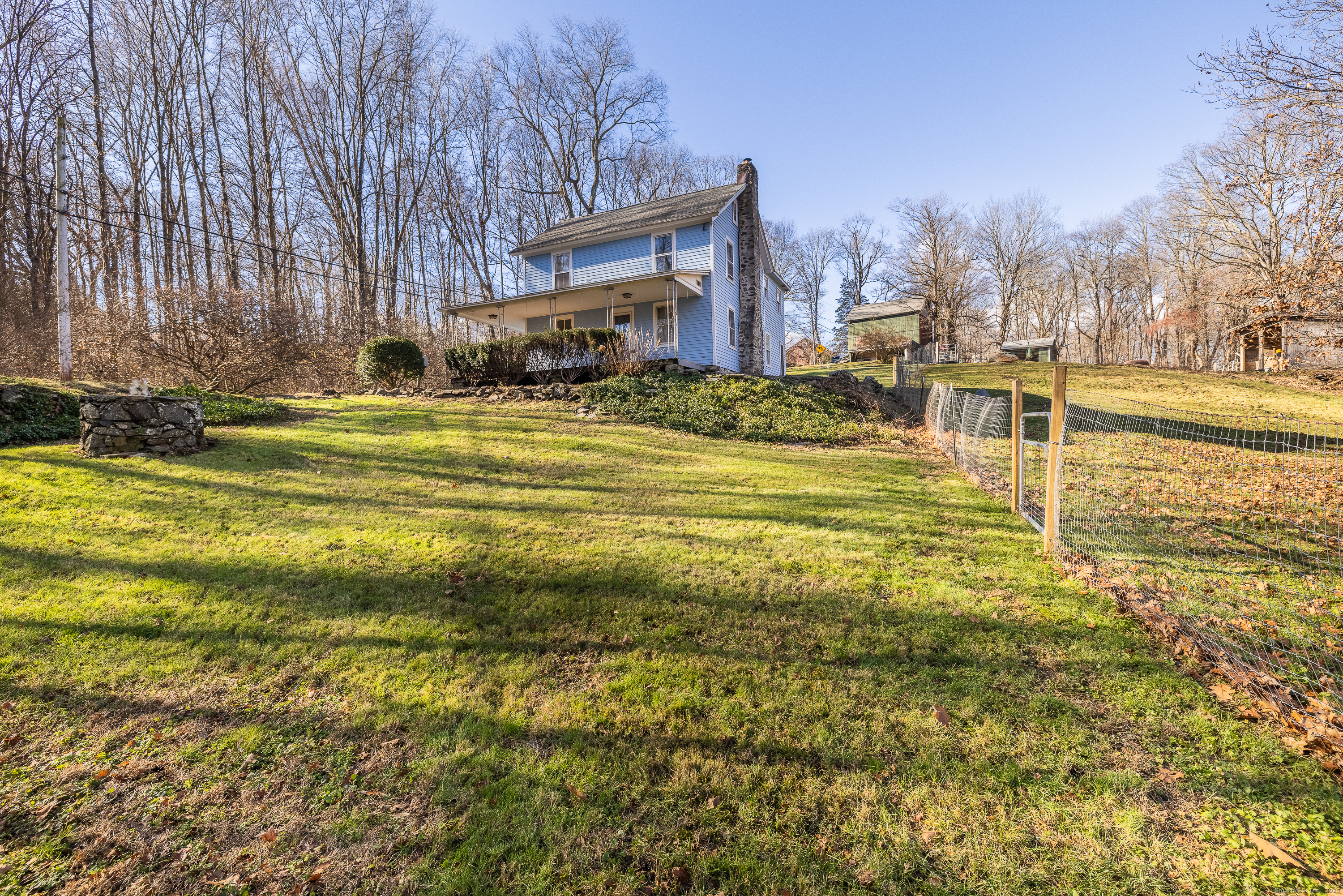 2 Stony Brook Road Newtown, CT 06470 - Photo 25 of 29 a house view with swimming pool in front of it