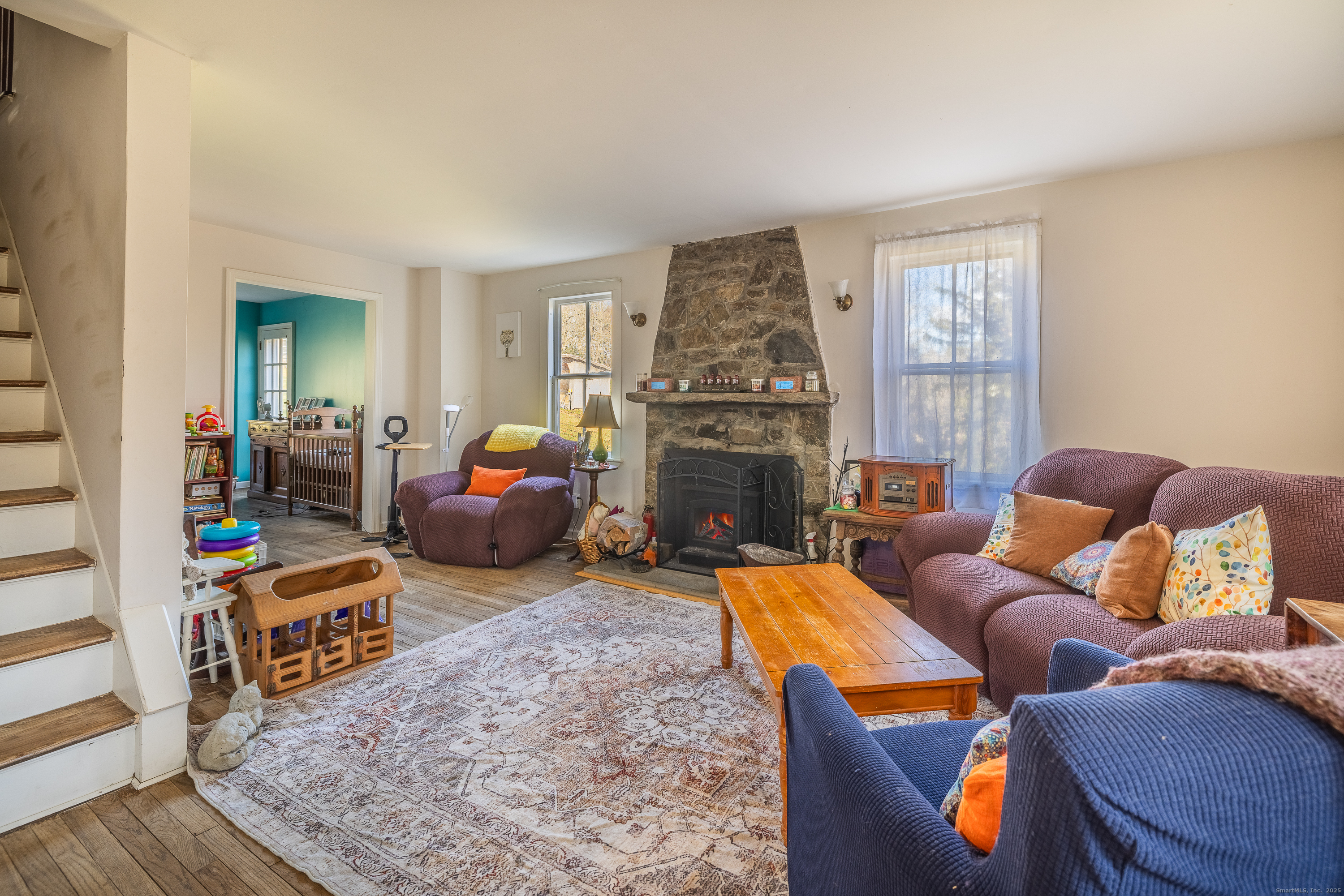 2 Stony Brook Road Newtown, CT 06470 - Photo 6 of 29 a living room with furniture and a fireplace