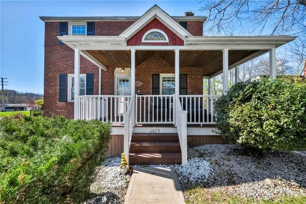 a outdoor living space with furniture and a fireplace
