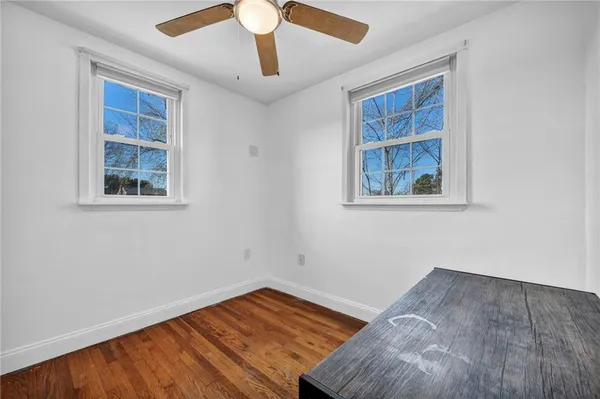 a view of an entryway with wooden floor