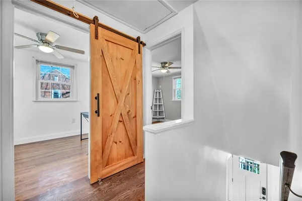 a bathroom with a toilet a sink and a mirror