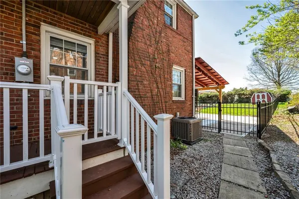 a view of a house with backyard and porch