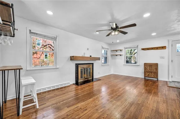 a dining room with furniture and wooden floor