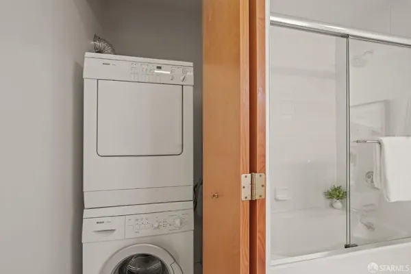 a bathroom with a toilet sink and shower