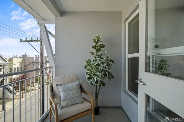 a view of a patio with couches chairs and potted plants