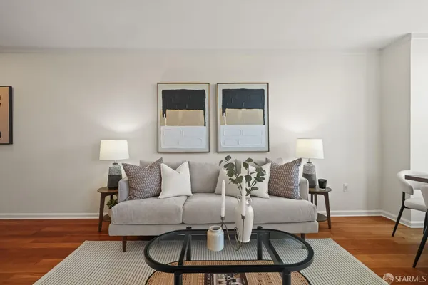 a living room with furniture and a lamp