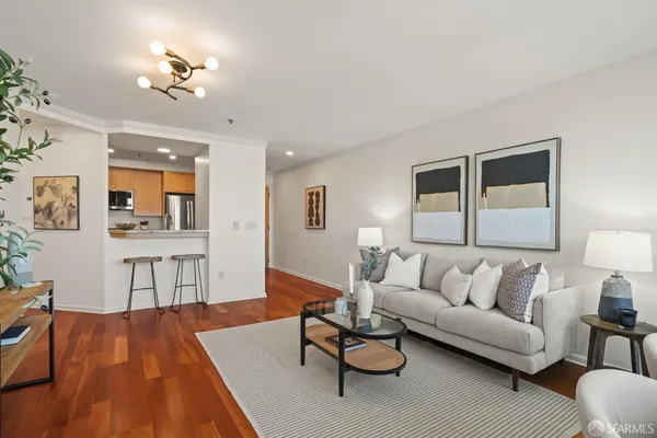 a living room with furniture fireplace and a table