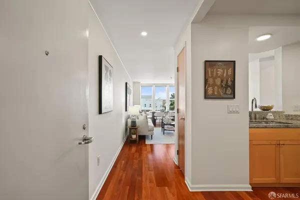 a view of a living room with kitchen