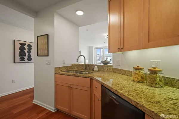 a kitchen with a sink and cabinets
