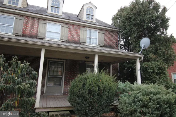 front view of house with a potted plant