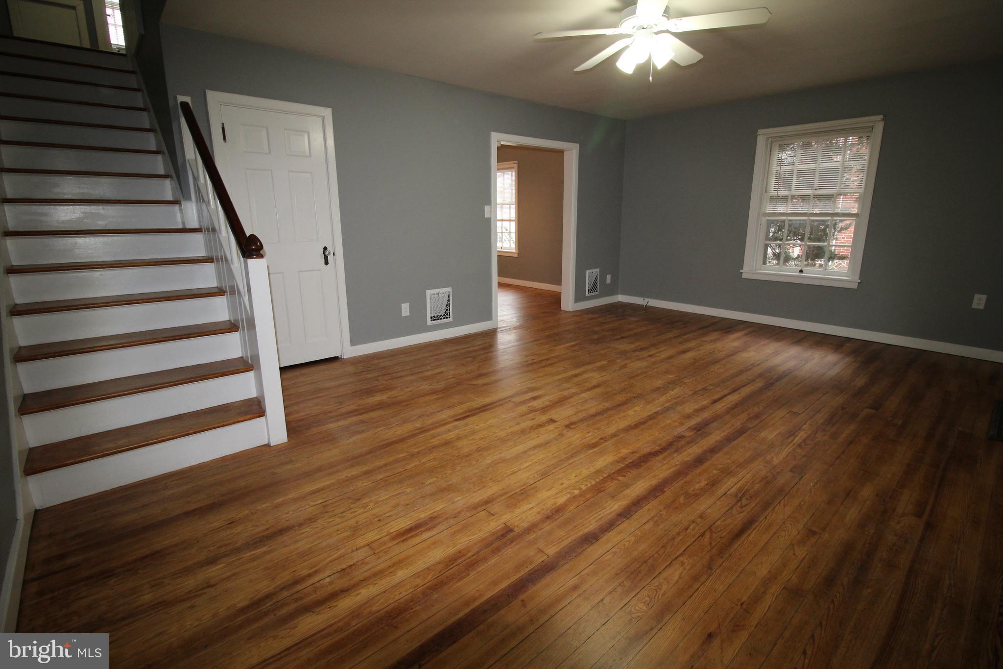 1076 Main Street East Earl, PA 17506 - Photo 4 of 11 wooden floor in an empty room with a window