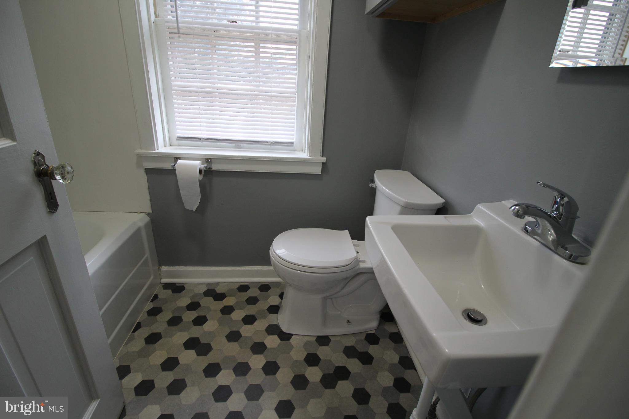 1076 Main Street East Earl, PA 17506 - Photo 10 of 11 a bathroom with a sink toilet and shower