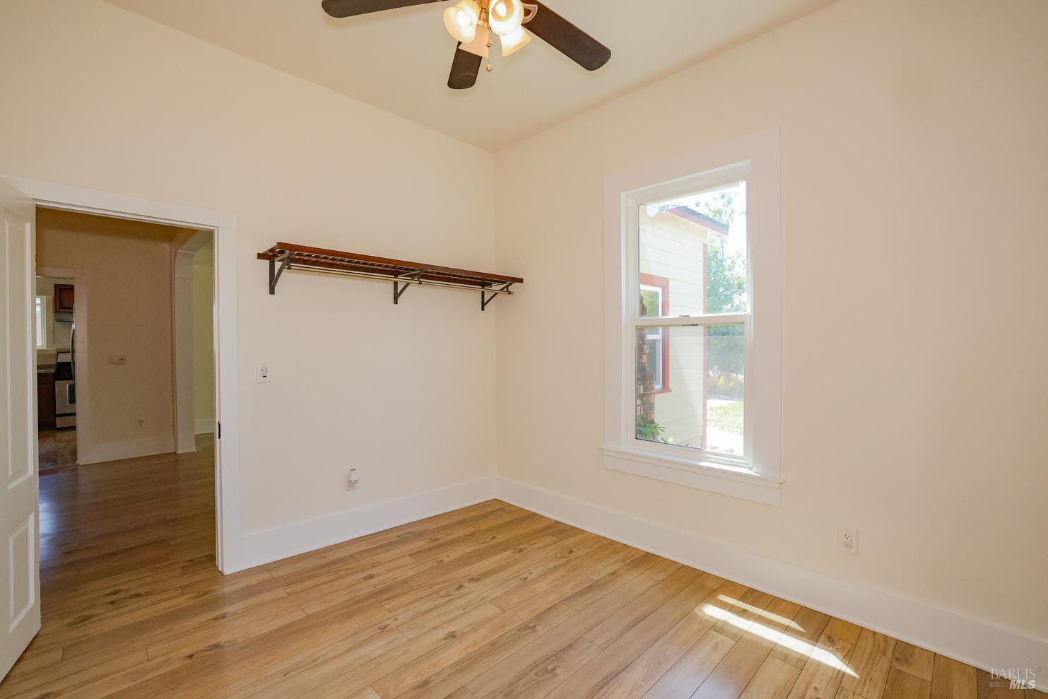 7948 North Meridian Road Dixon, CA 95620 - Photo 21 of 59 wooden floor in an empty room with a window