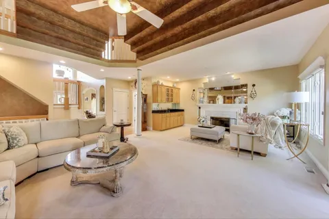 a living room with furniture and white walls
