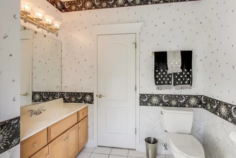 a bathroom with a sink and toilet