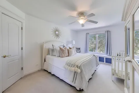 a bed room with a bed and a window