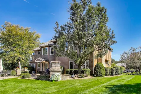 a view of a backyard with sitting area