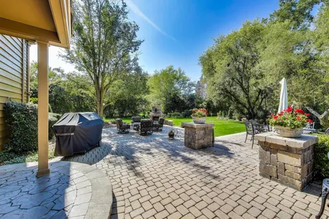 a view of a house with a yard porch and sitting area