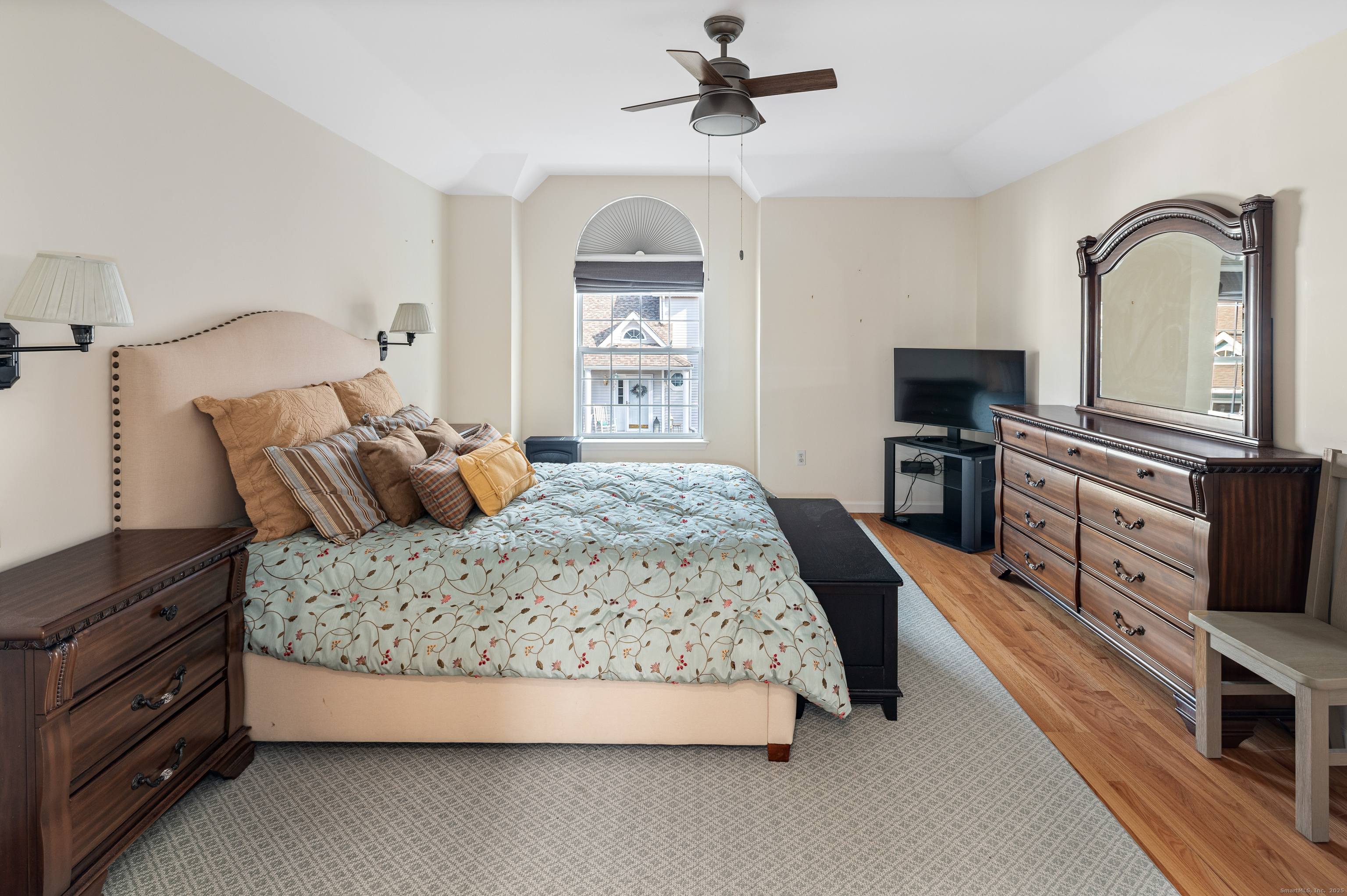 596 Glenbrook Road, Unit 36 Stamford, CT 06906 - Photo 12 of 25 a bedroom with a bed and a flat screen tv