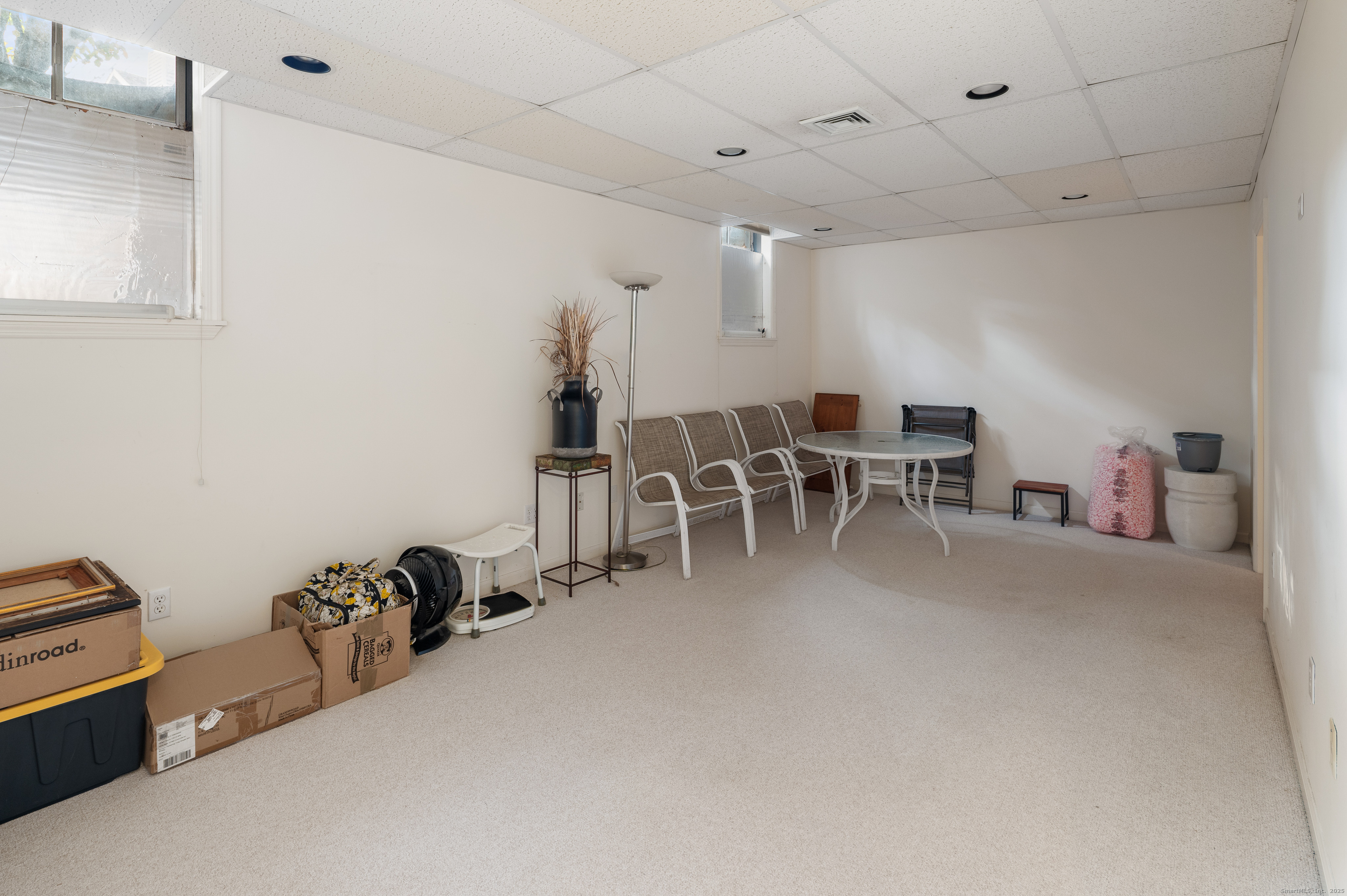 596 Glenbrook Road, Unit 36 Stamford, CT 06906 - Photo 18 of 25 a dining room with furniture and a view of bedroom