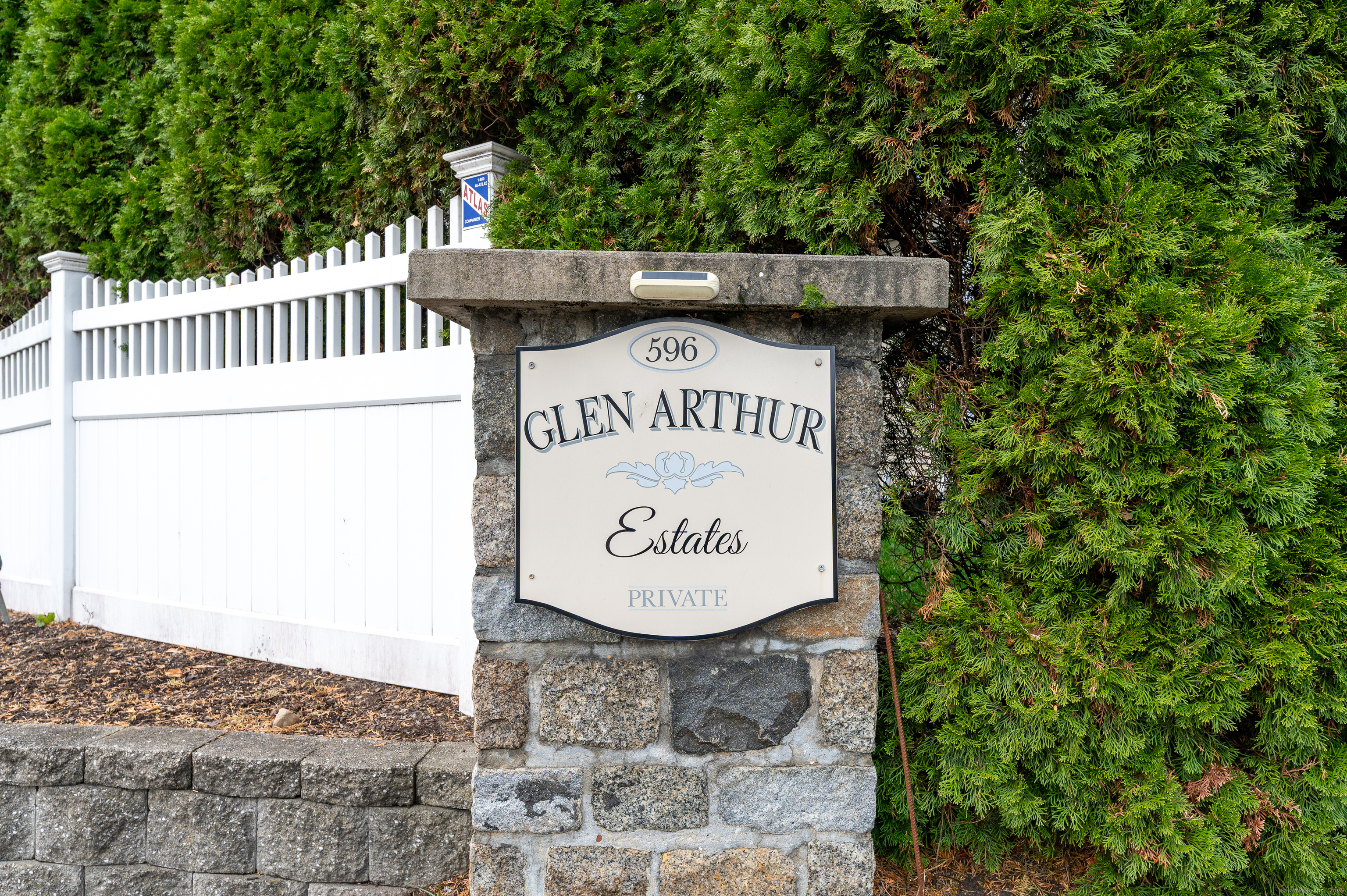 596 Glenbrook Road, Unit 36 Stamford, CT 06906 - Photo 21 of 25 a sign on the side of a building