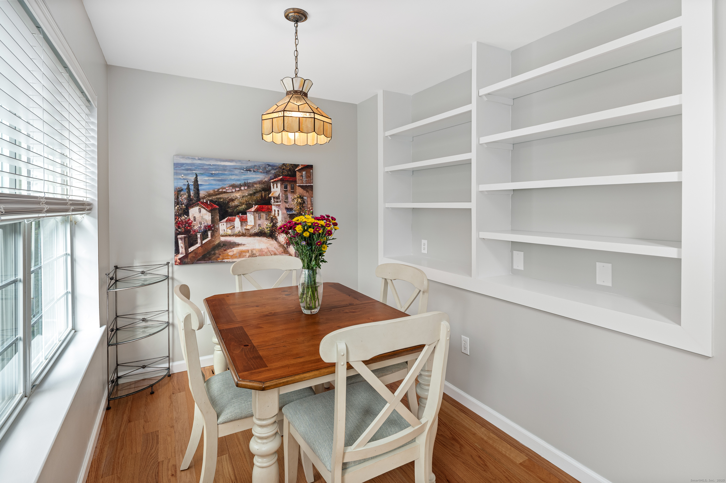 596 Glenbrook Road, Unit 36 Stamford, CT 06906 - Photo 8 of 25 a view of a dining room with furniture and a chandelier
