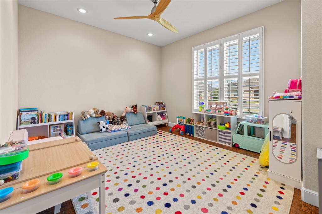 3801 Kady Ridge Abilene, TX 79606 - Photo 29 of 40 Vaulted ceiling with a wood-finish ceiling fan, recessed lighting, and a large window with plantation shutters
