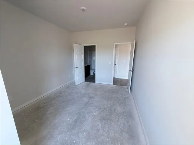 a view of a big room with closet and wooden floor