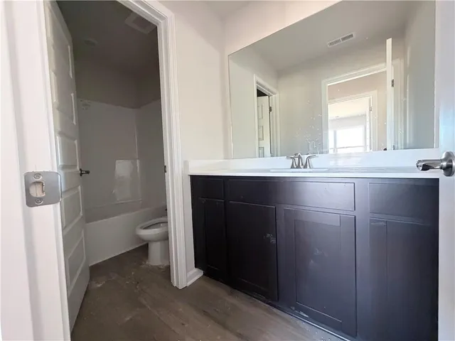 wooden floor and window in an empty room