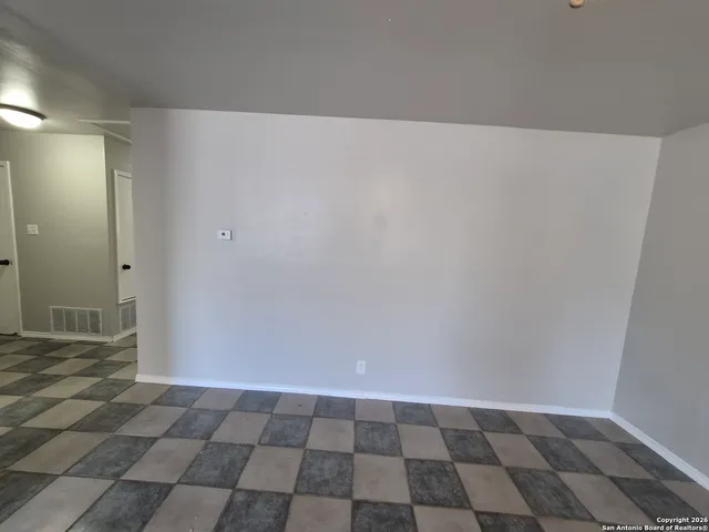 a view of an empty room and window