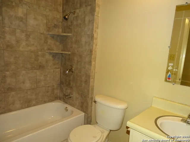 a house that has a tree in front of it