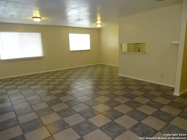 a view of an empty room and window