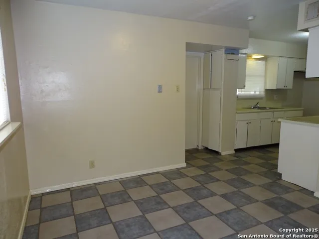 a view of a kitchen with a sink