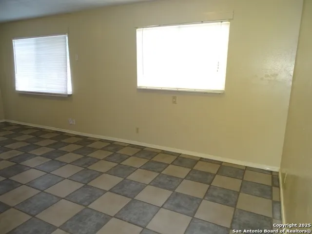 a view of an empty room and window