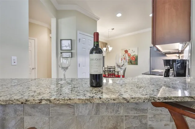 a view of a dining room with furniture wooden floor and chandelier