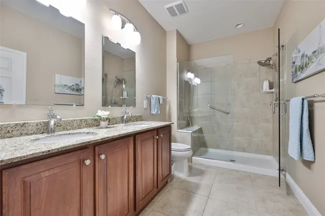 a sign board with a small yard and palm trees