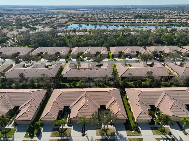 a view of balcony with wooden floor and outdoor seating