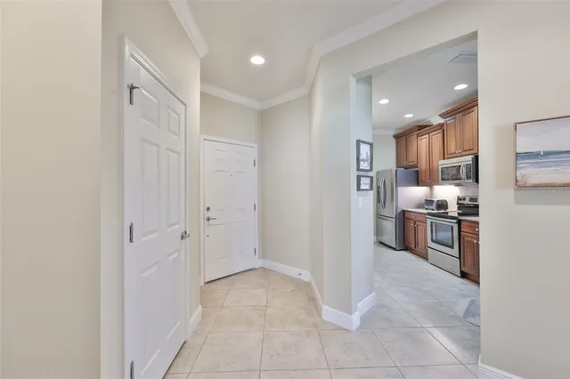 a view of a dining room with furniture and a chandelier