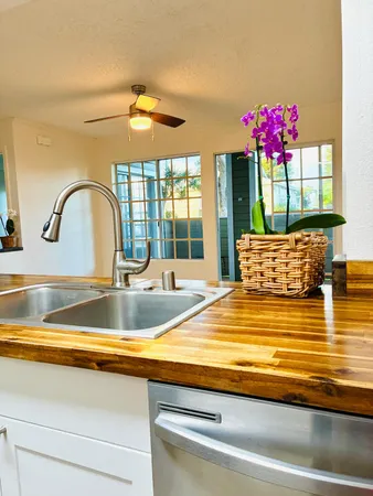 a view of living room with furniture and flower pot