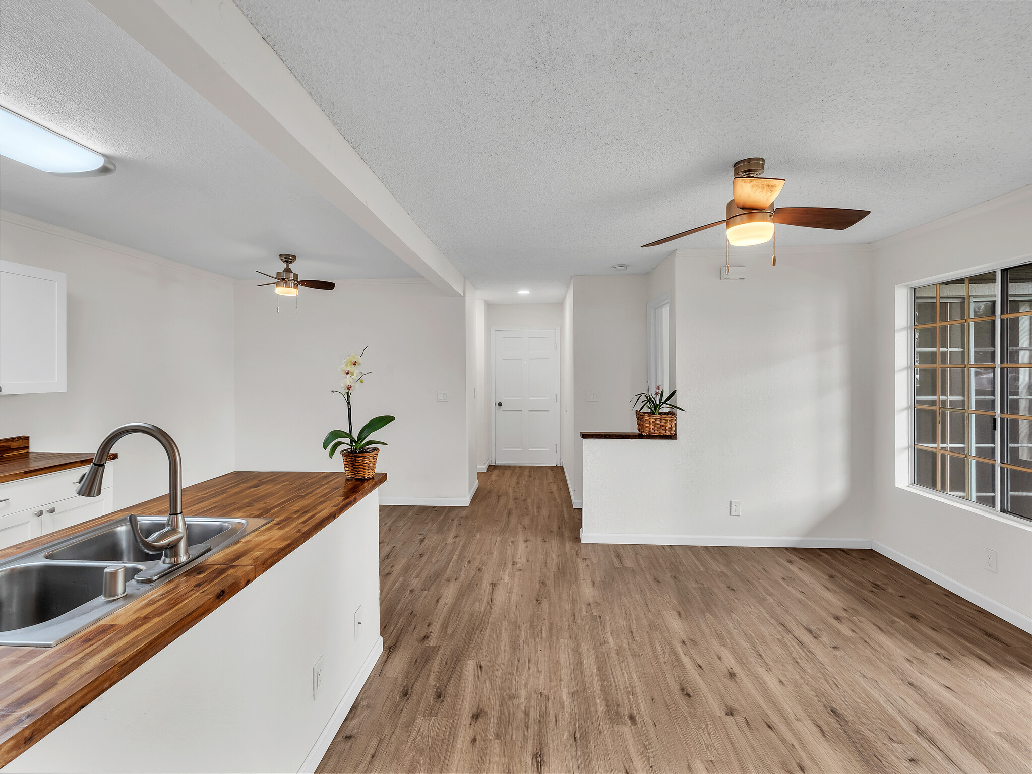 68-3883 Lua Kula Street, Unit 2102 Waikoloa, HI 96738 - Photo 1 of 29 a kitchen with sink and cabinets