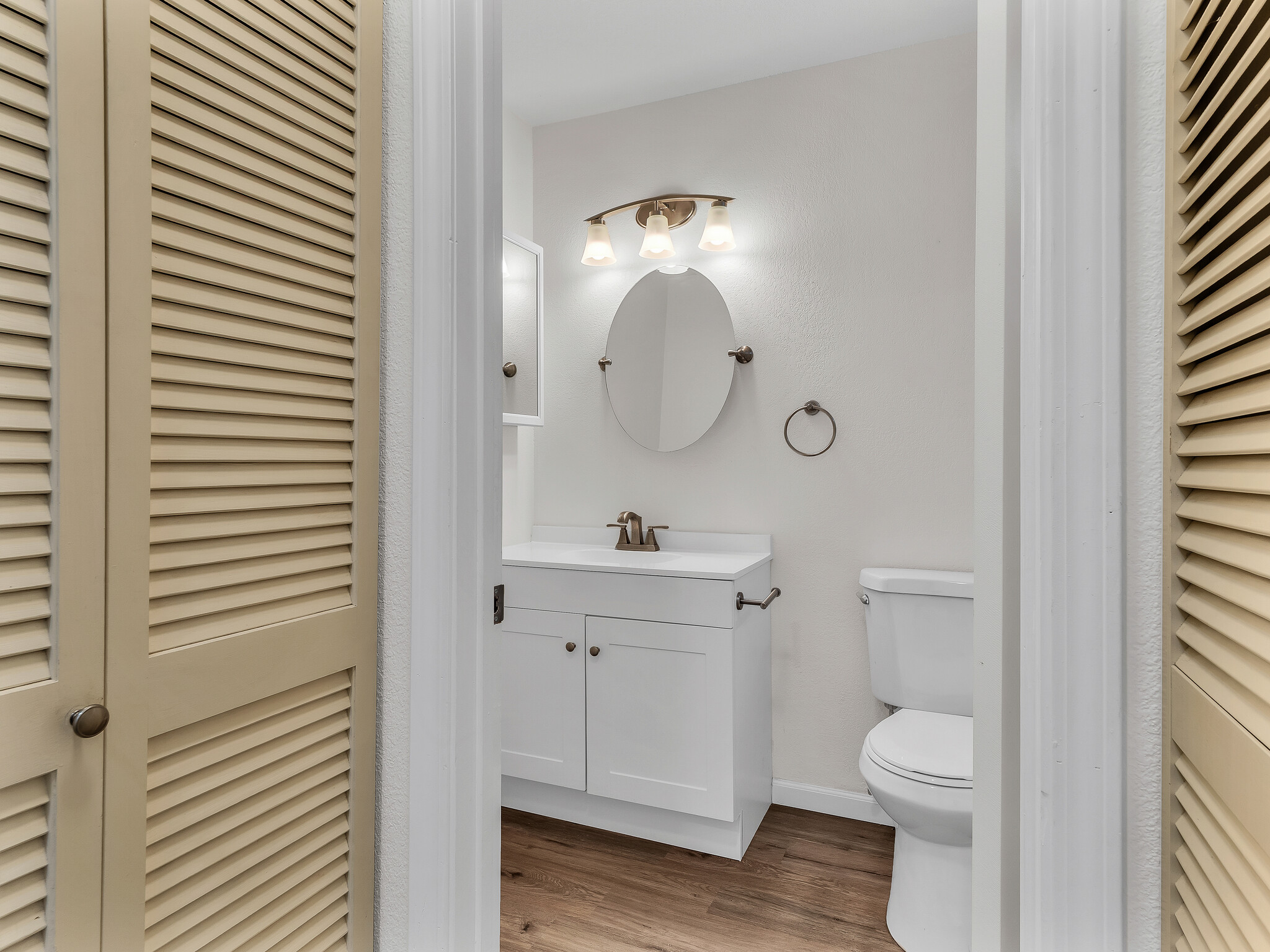 68-3883 Lua Kula Street, Unit 2102 Waikoloa, HI 96738 - Photo 13 of 29 a bathroom with a toilet a sink and mirror