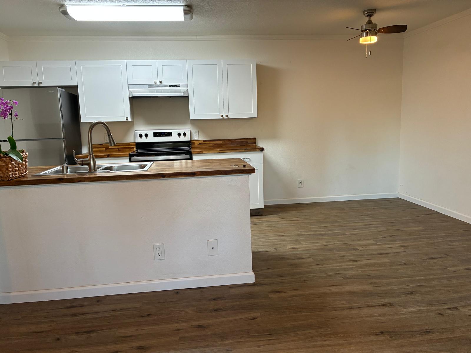 68-3883 Lua Kula Street, Unit 2102 Waikoloa, HI 96738 - Photo 16 of 21 a view of kitchen with wooden floor