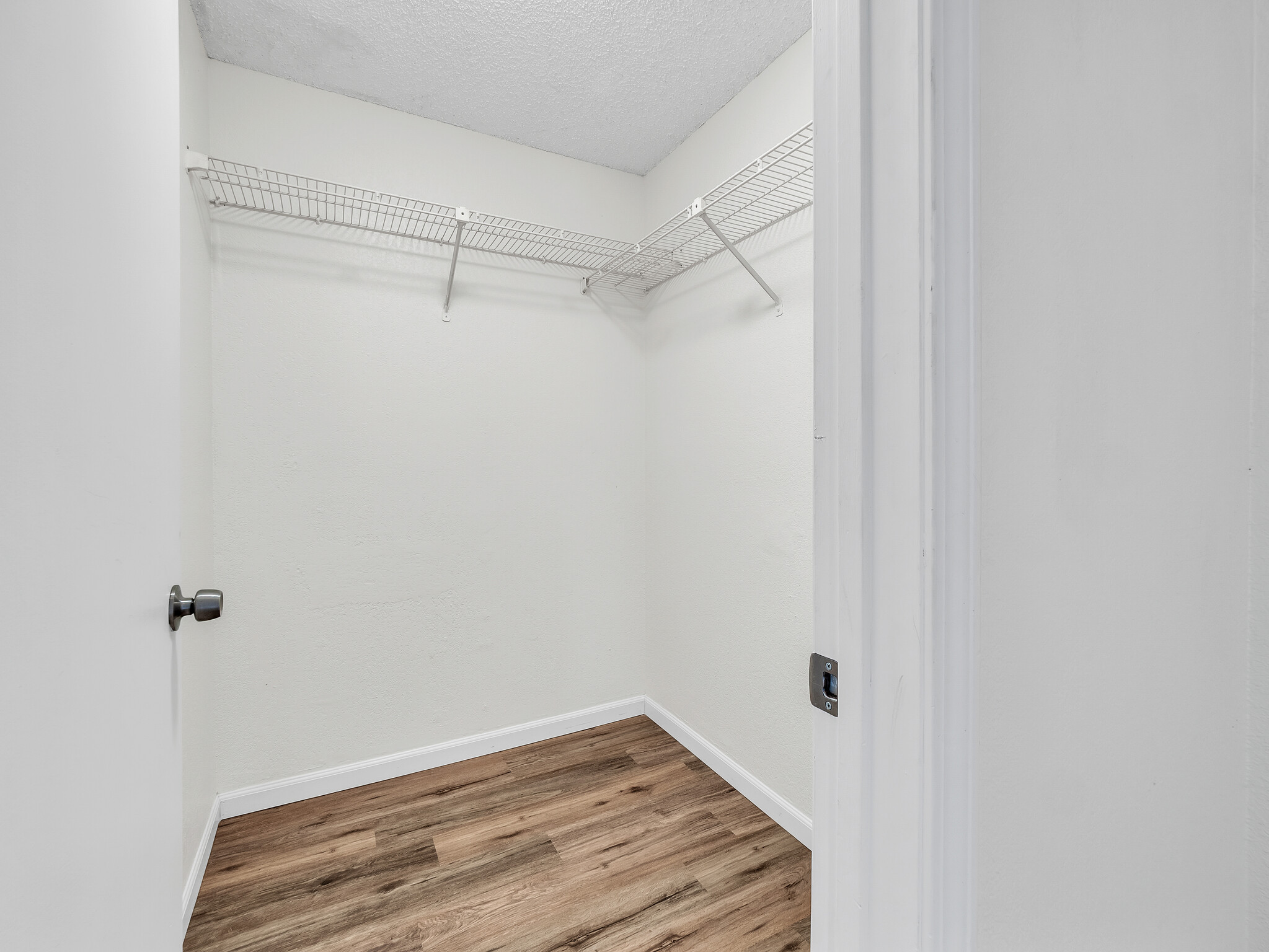 68-3883 Lua Kula Street, Unit 2102 Waikoloa, HI 96738 - Photo 17 of 29 a view of a room with wooden floor
