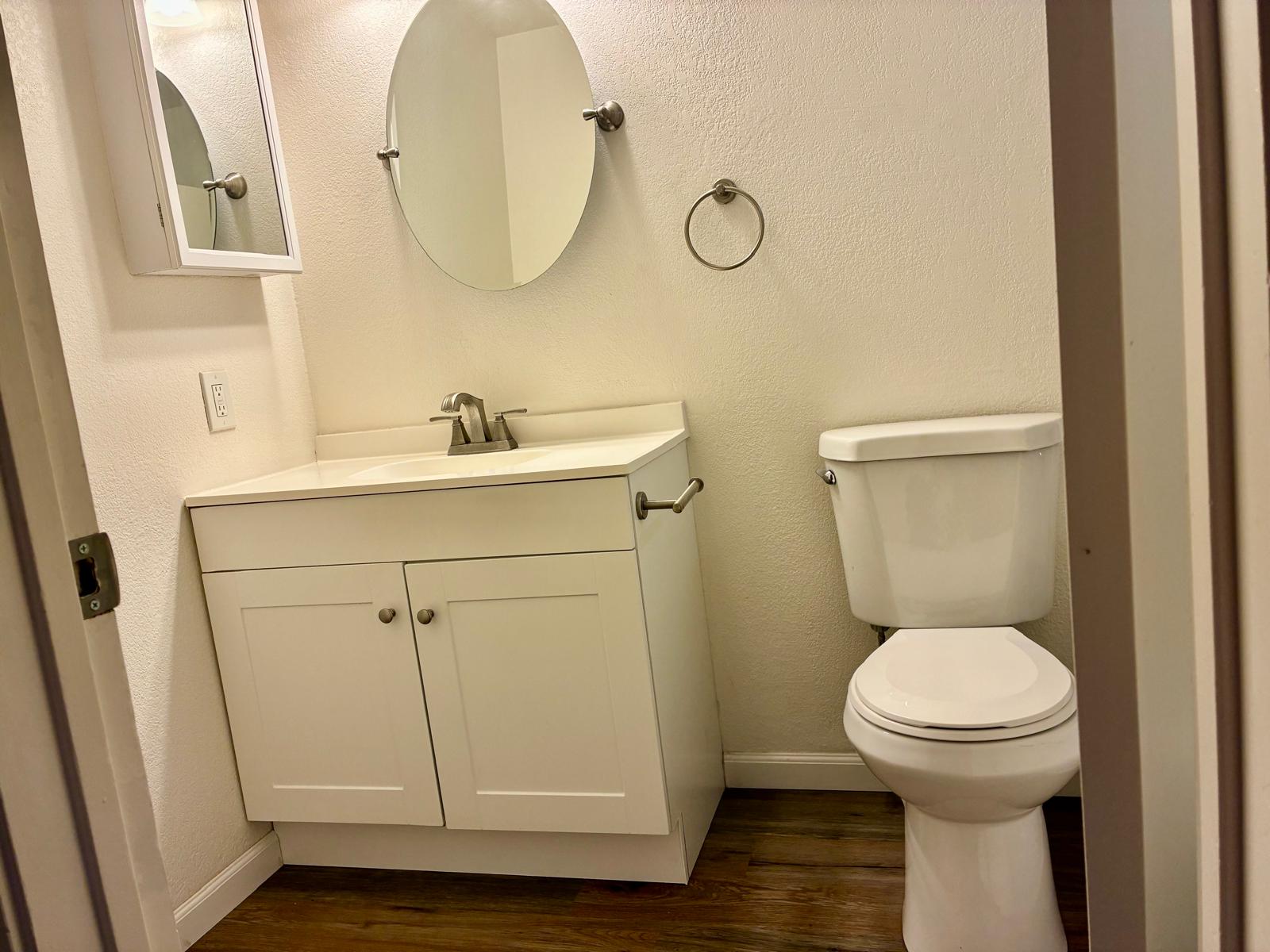 68-3883 Lua Kula Street, Unit 2102 Waikoloa, HI 96738 - Photo 17 of 21 a bathroom with a sink mirror and toilet